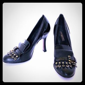 Louis Vuitton Kiltie pumps.